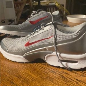 Silver and red Nike Airs